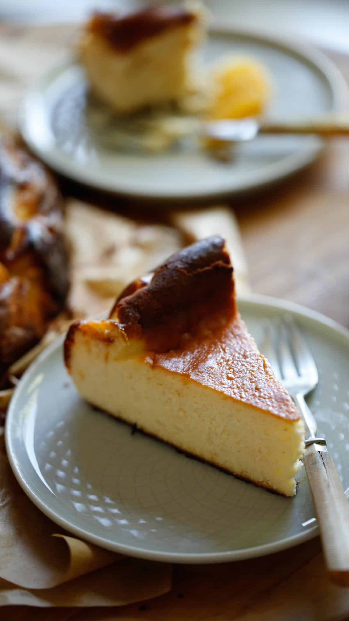 a slice of cheesecake on a plate with a fork