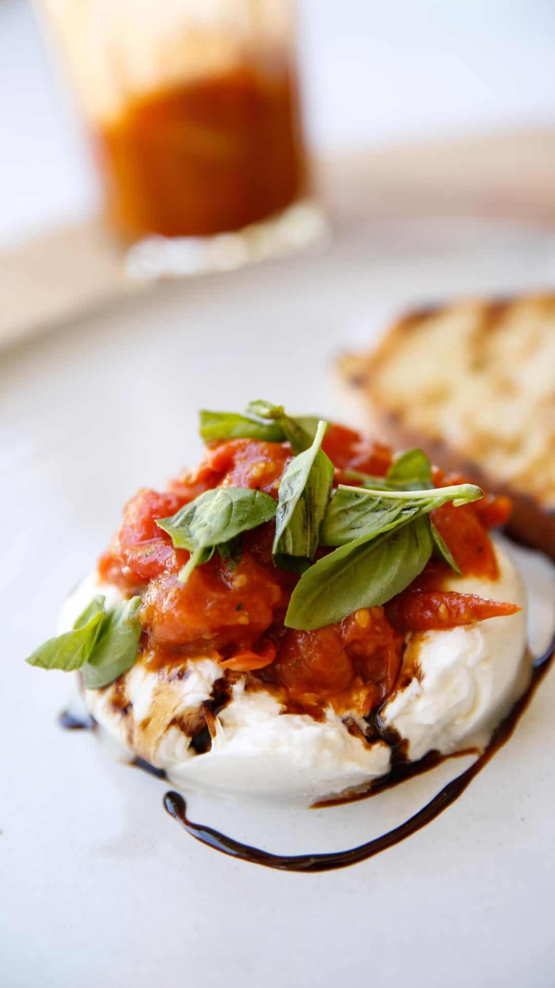 Burata Cheese topped with tomato jam and basil