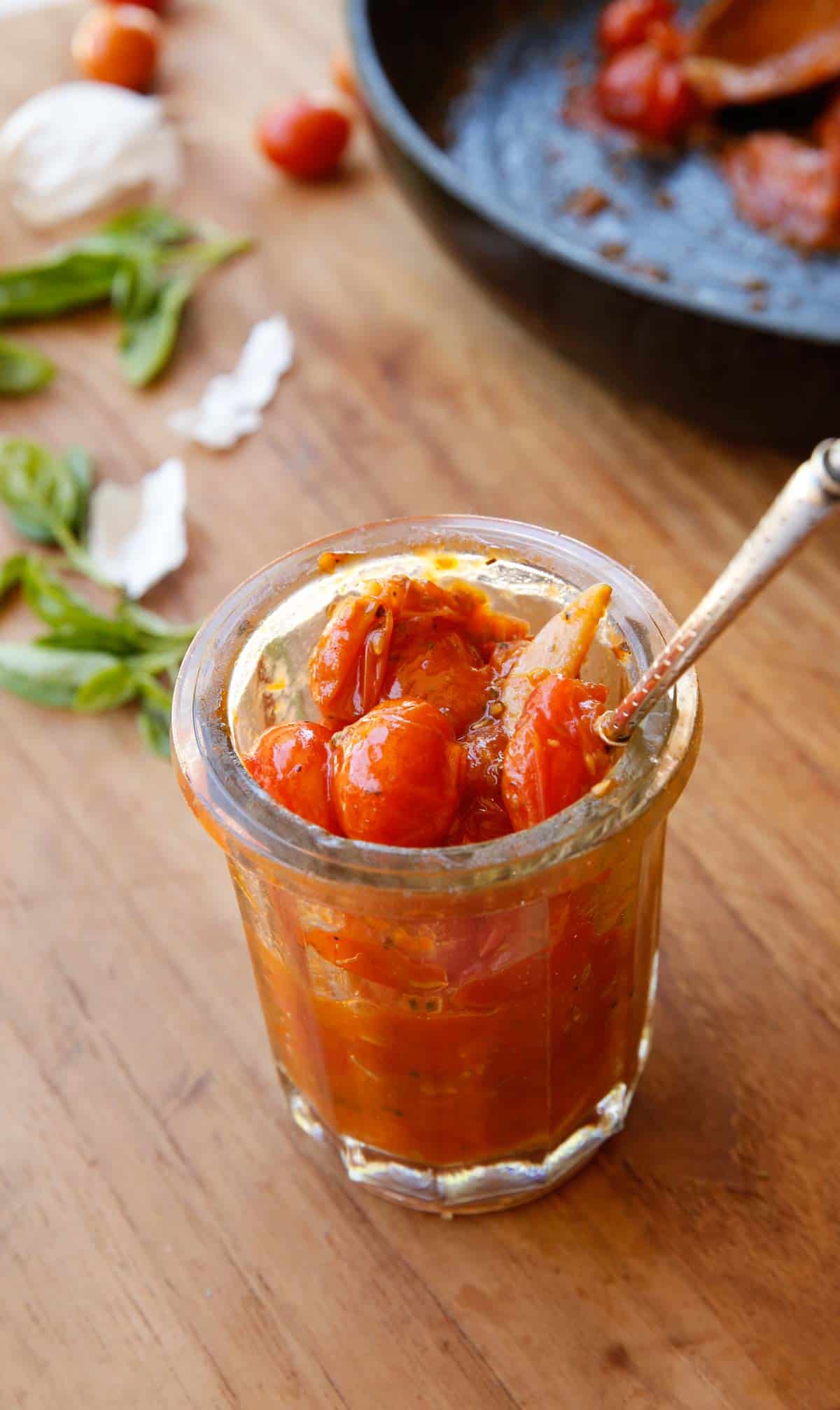 A Jam Jar Filled with Tomato Jam and a Silver Spoon