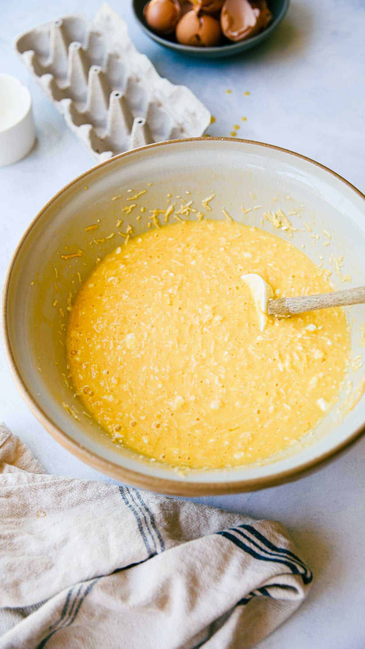 a mixing bowl filled with egg batter