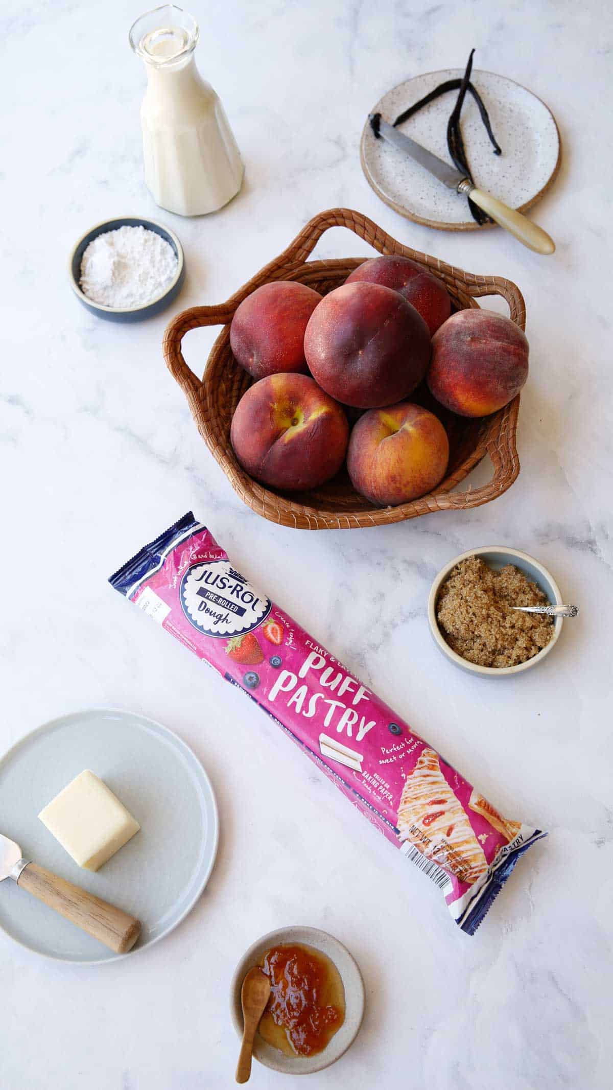 Ingredients on a counter for a peach tarte