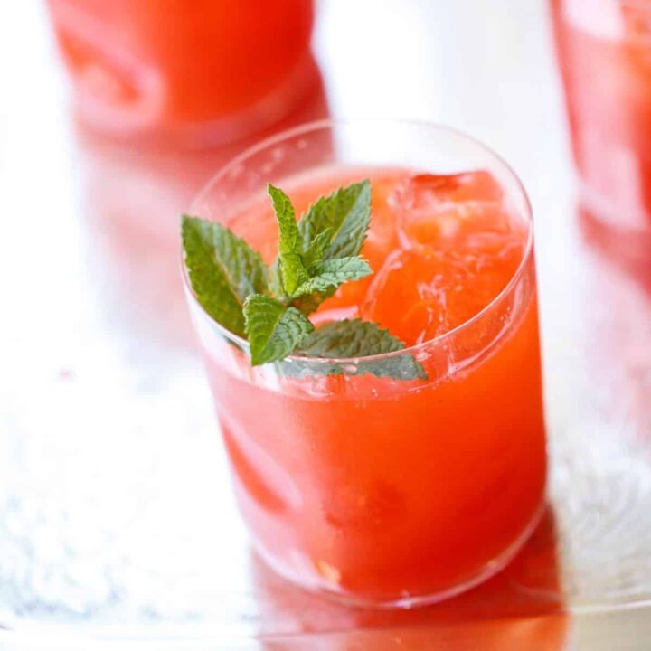 a glass of strawberry lemonade with mint garnish