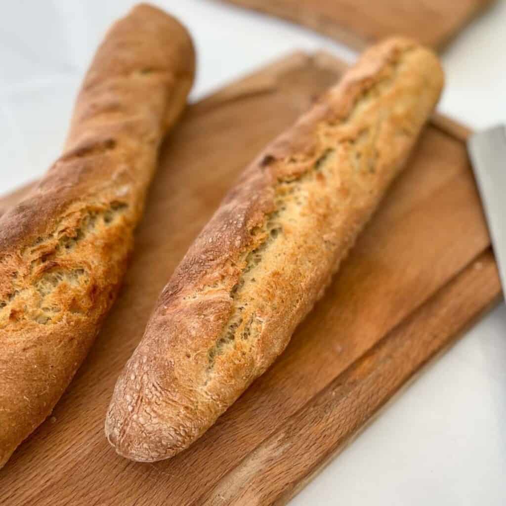 Baguettes freshly baked on a cutting board
