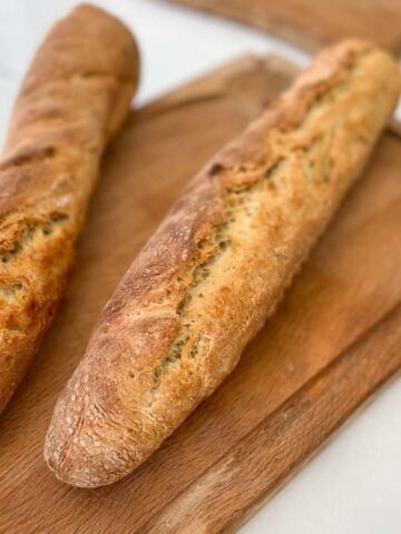 Baguettes freshly baked on a cutting board