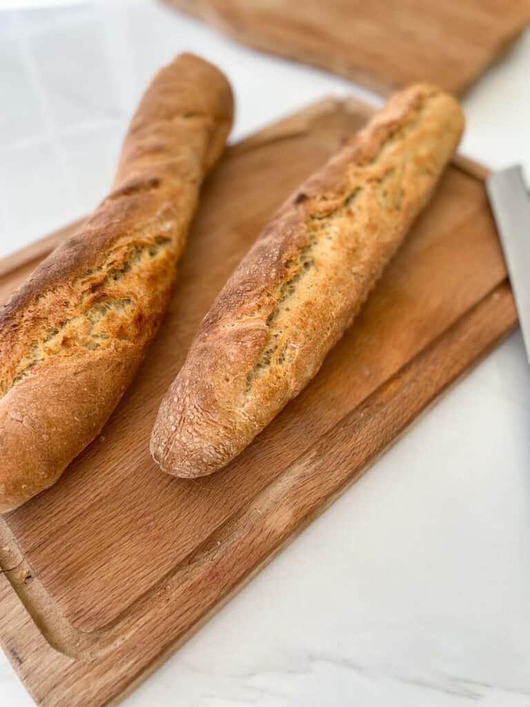 2 loaves of bread on a cutting board