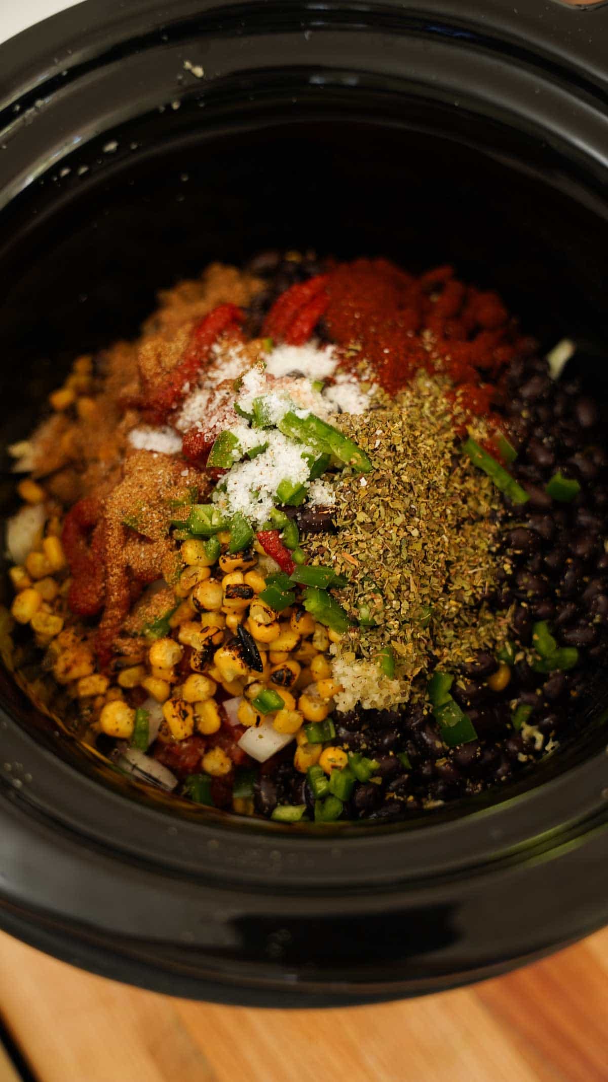 Ingredients piled into a slow cooker