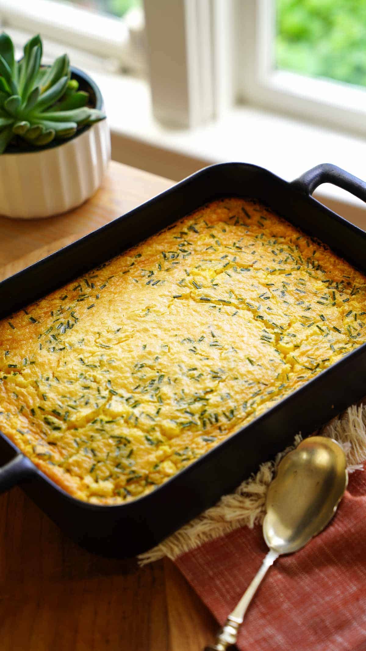 a large casserole of corn pudding casserole