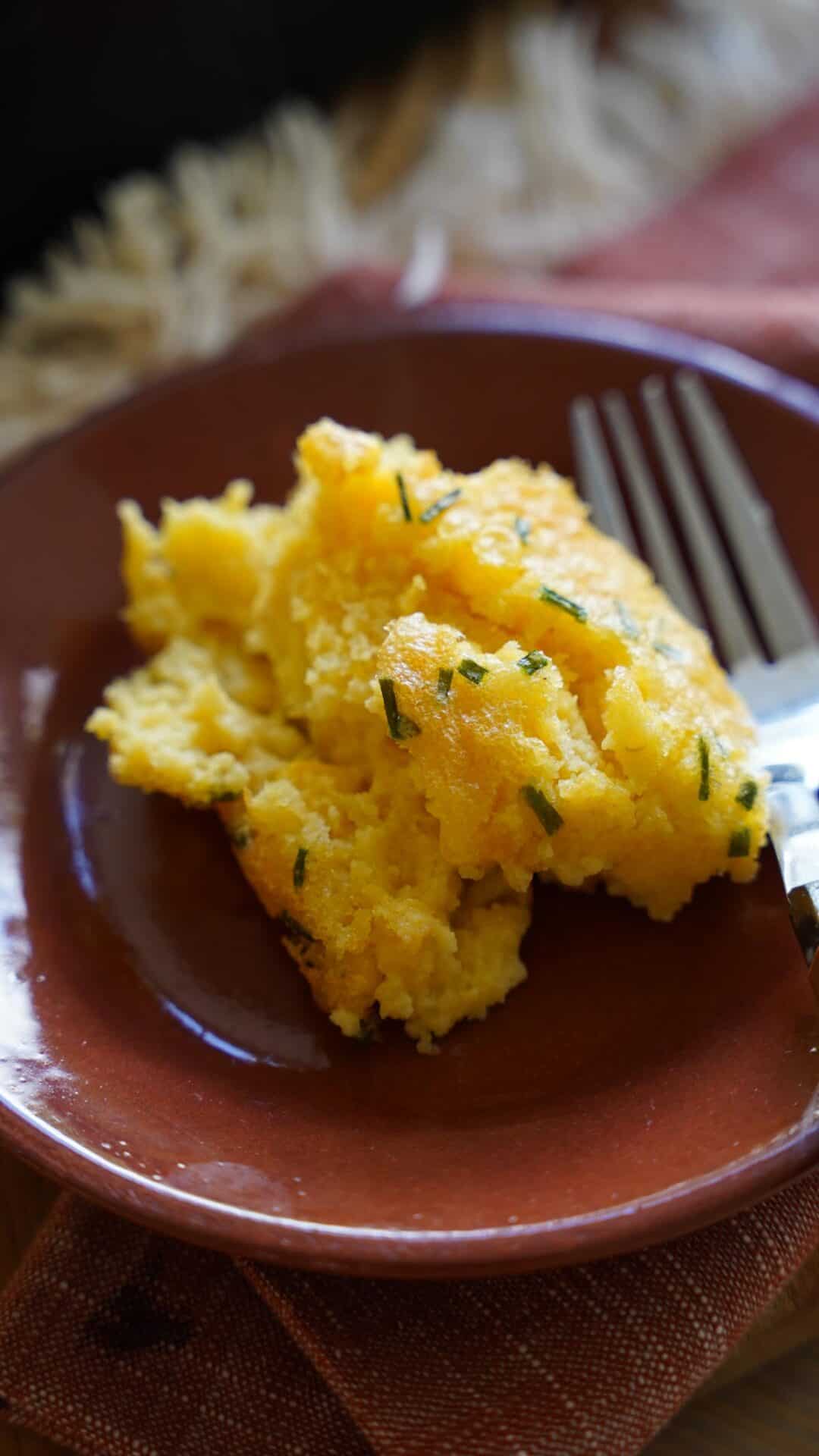 a single serving of corn pudding on a plate