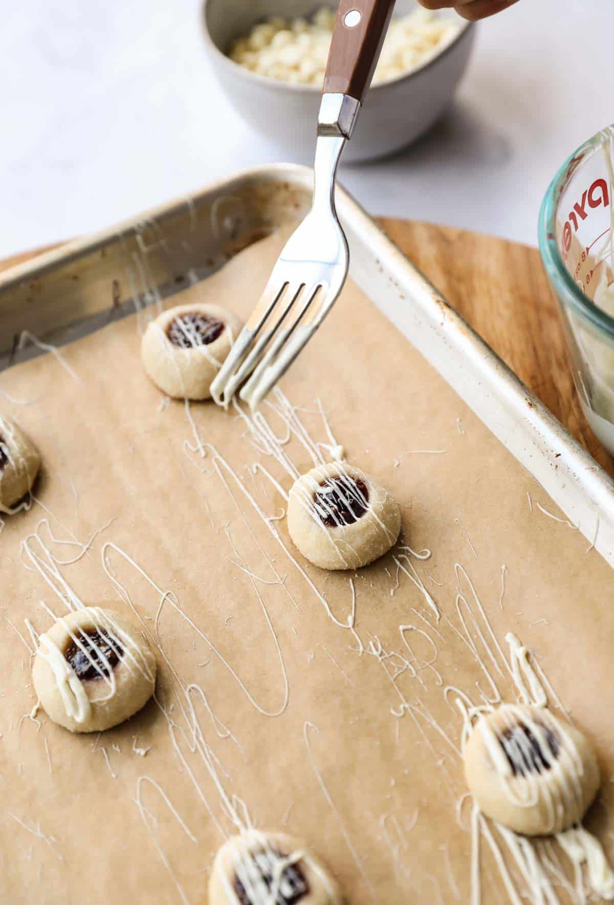 White Chocolate being drizzled on a cookie