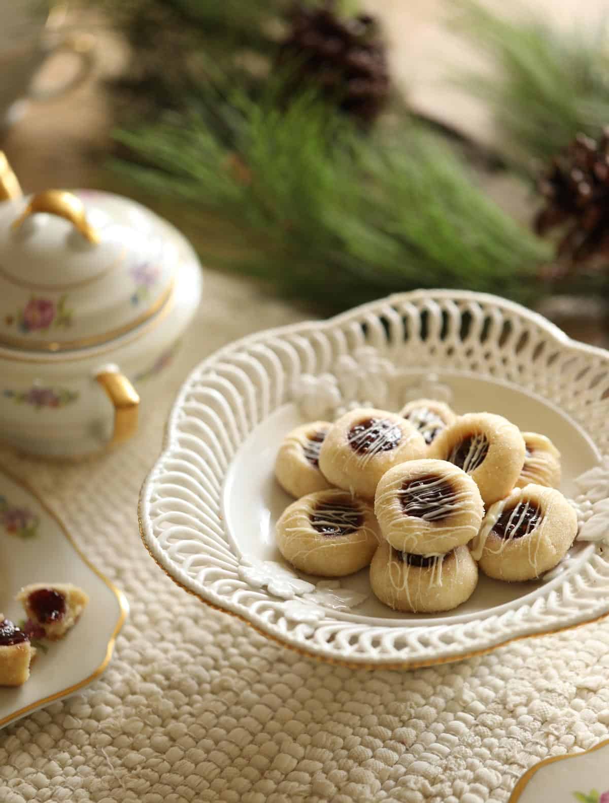 a little tea party set up with a platter filled with Thumbprint cookies