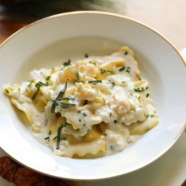 Lobster Ravioli and Sauce in a white bowl