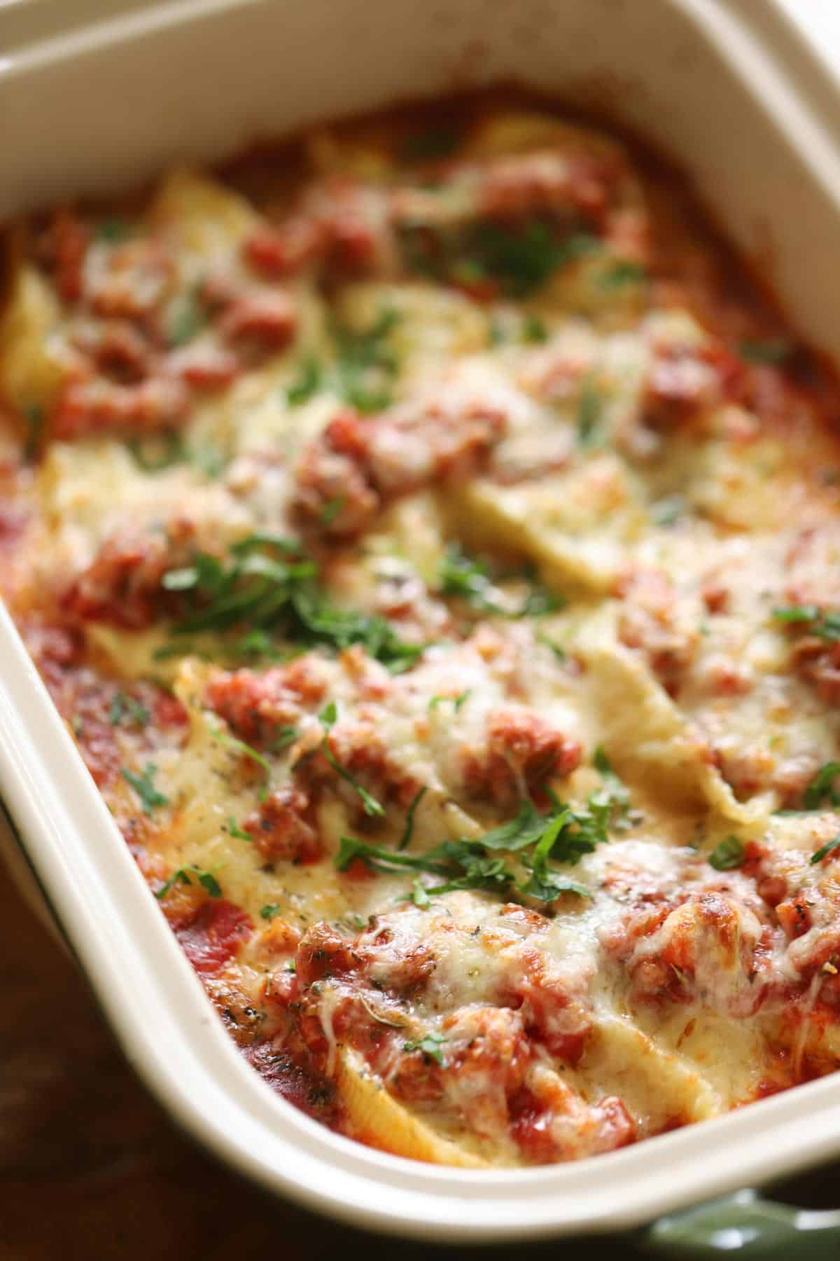 A casserole of cheese, tomato sauce and shells stuffed with ricotta cheese