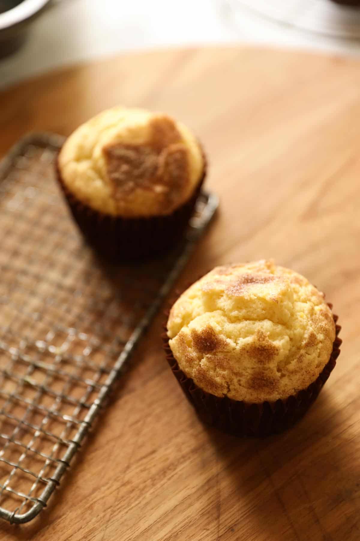 two muffins on a cutting board