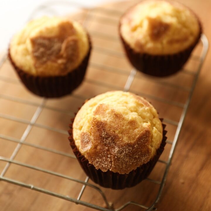 Snickerdoodle muffins on a cooling rack
