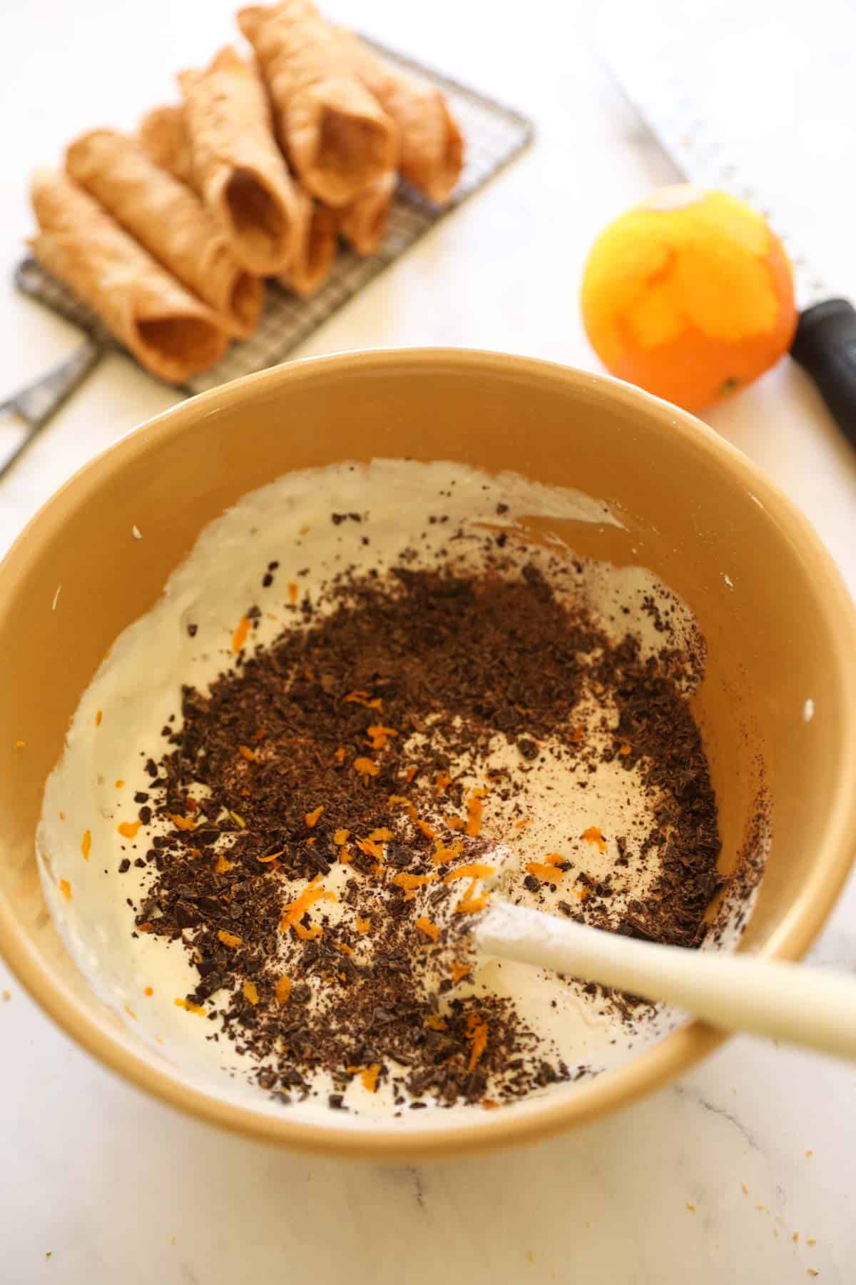 a bowl of homemade cannoli cream being whipped up