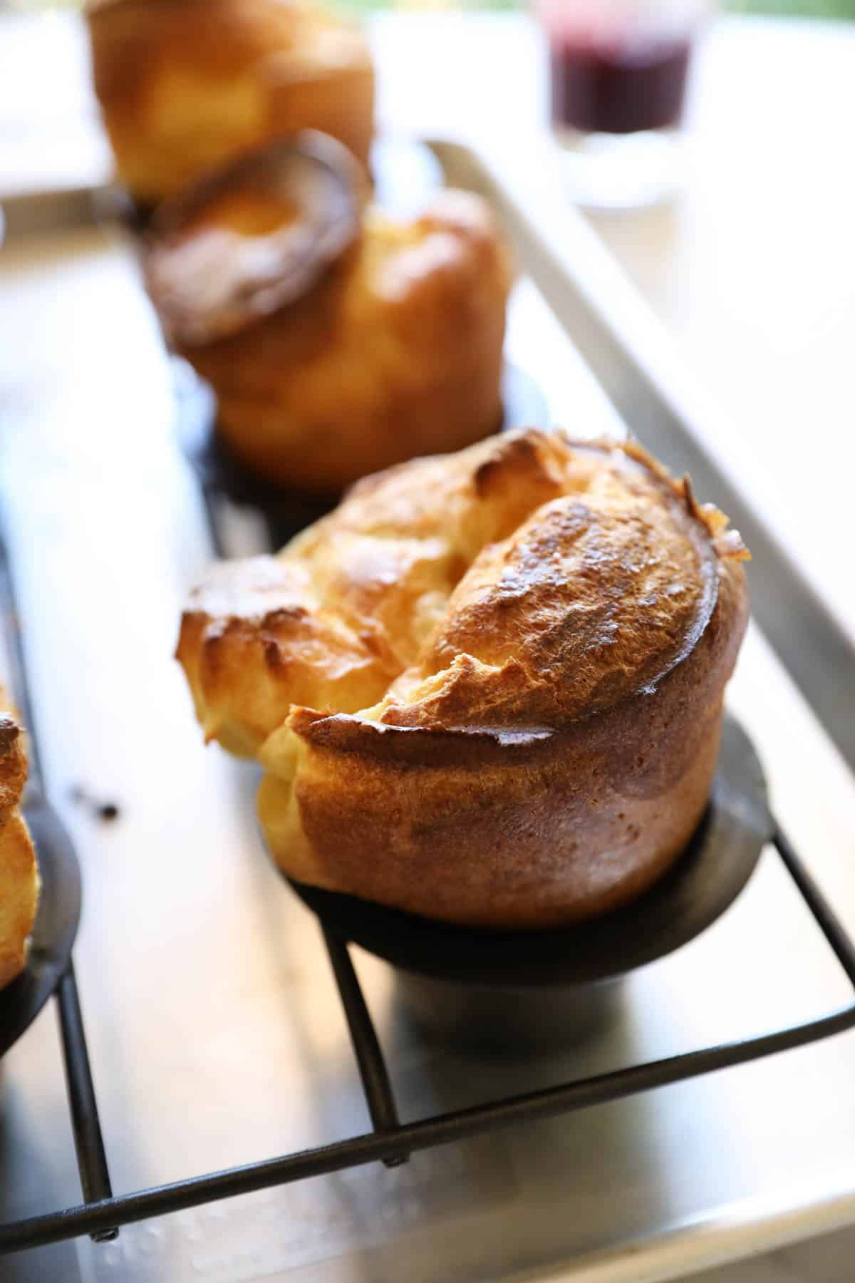 a popover in a pan with jam in the background