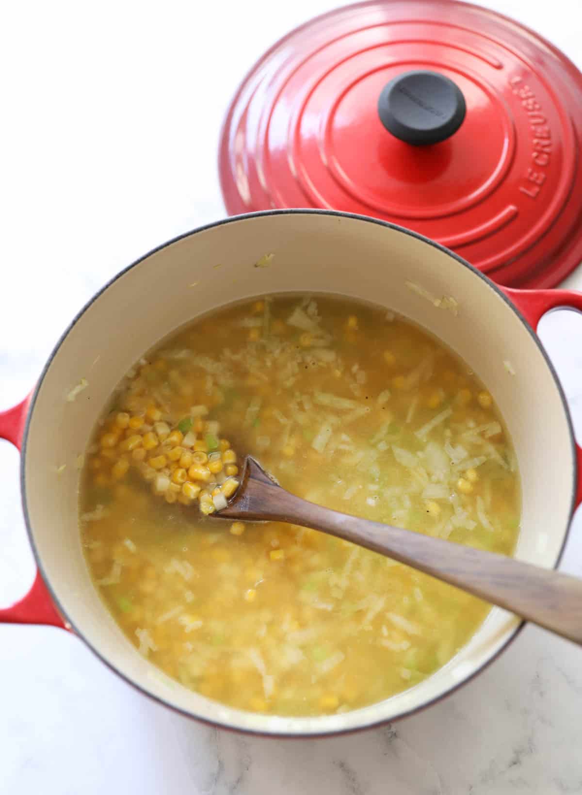 corn and potato simmering in chicken broth
