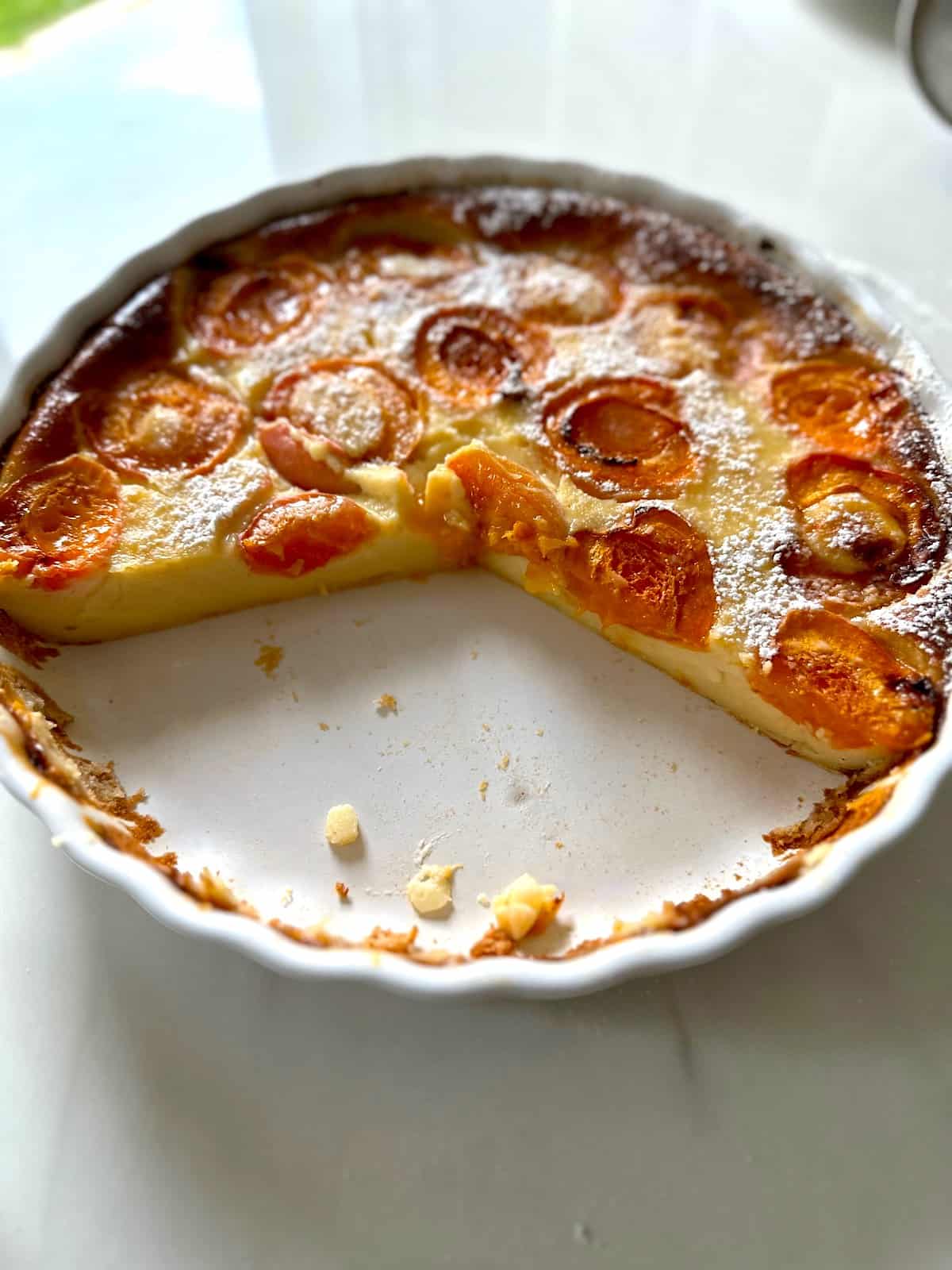 A sliced into apricot clafoutis