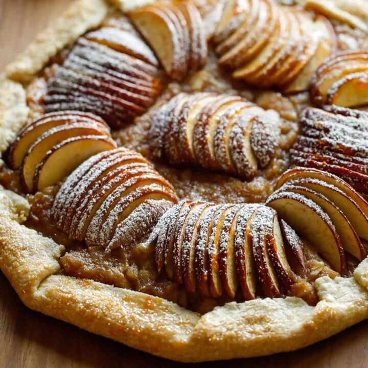an apple galette garnished with powdered sugar
