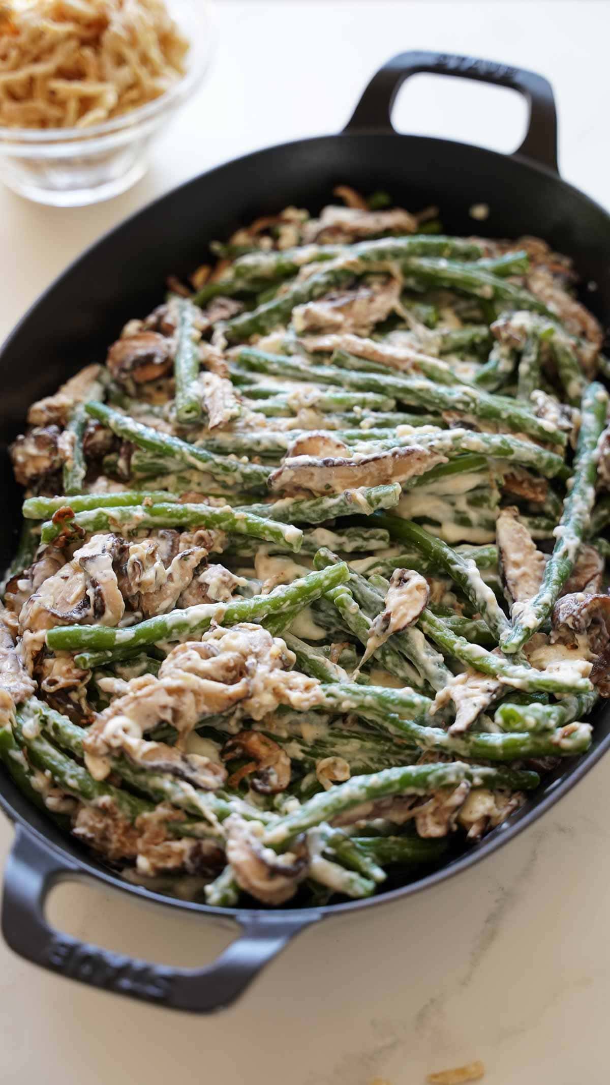 Green beans and mushroom mixture in a gratin pan