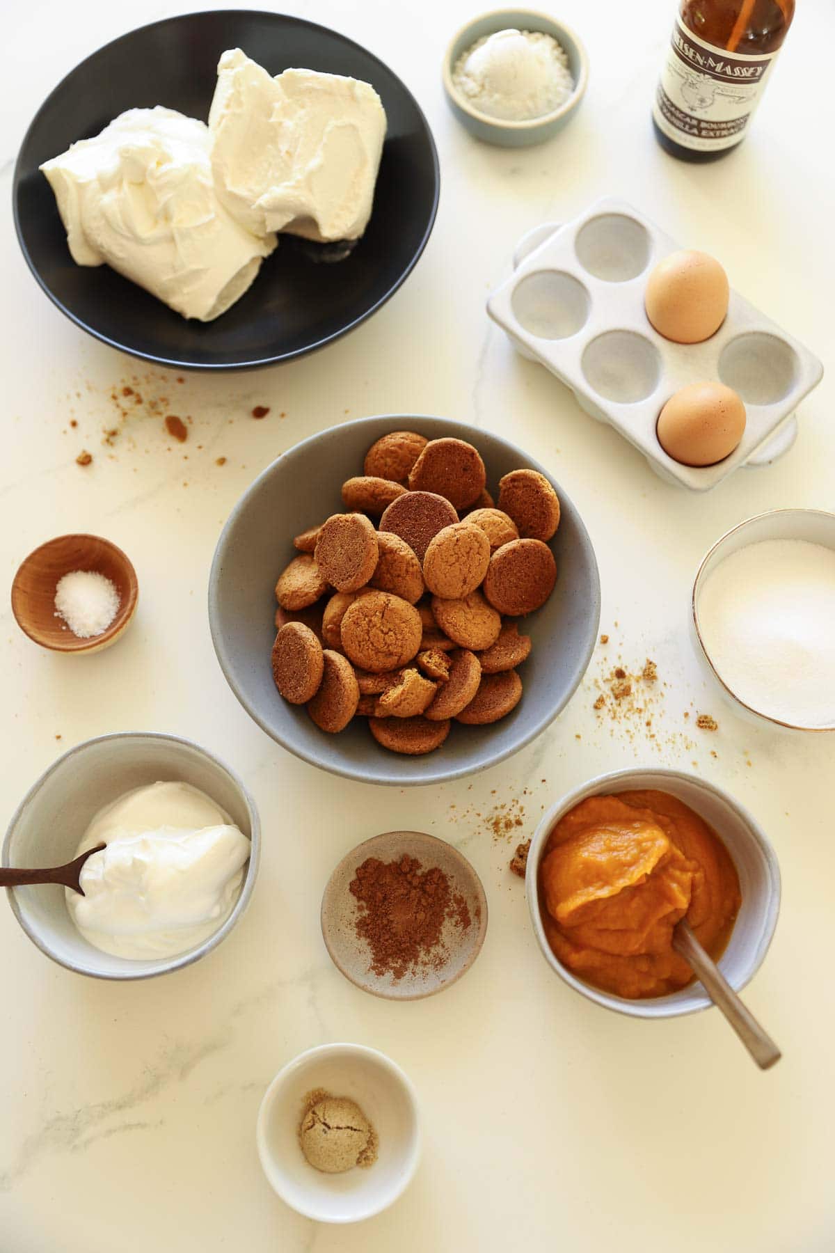 Ingredients for cheesecake pumpkin bars on a counter