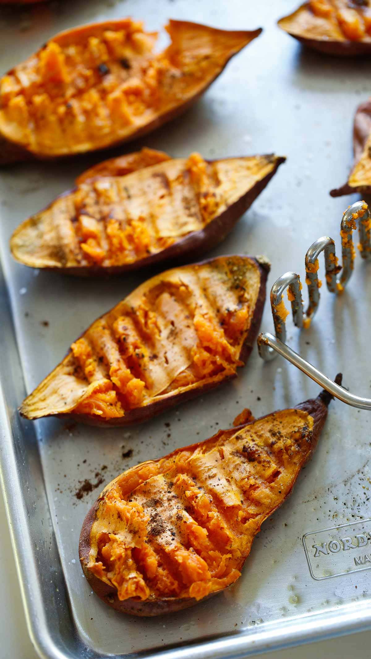 Sweet Potato Halves Baked until tender and smashed with a potato Masher