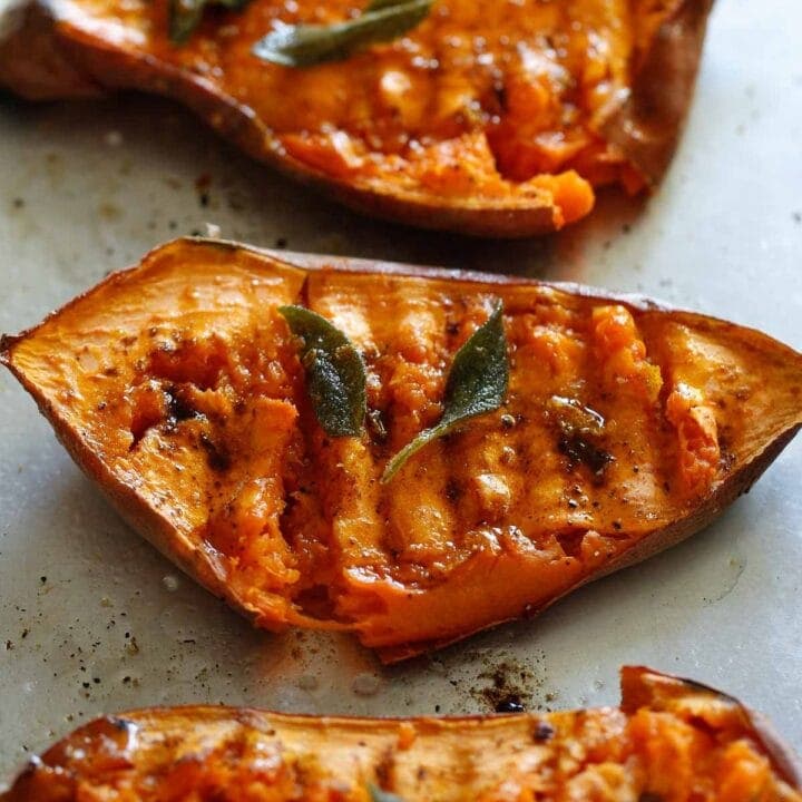 Smashed Sweet Potatoes and sage on a tray