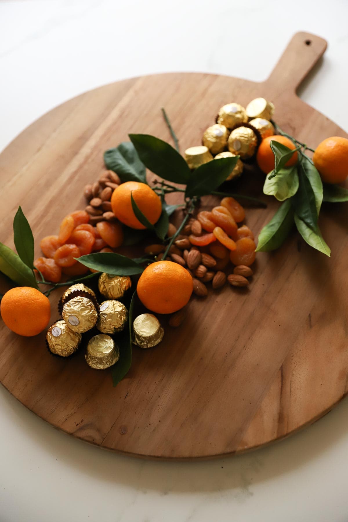 A grazing board with nuts and dried apricot 