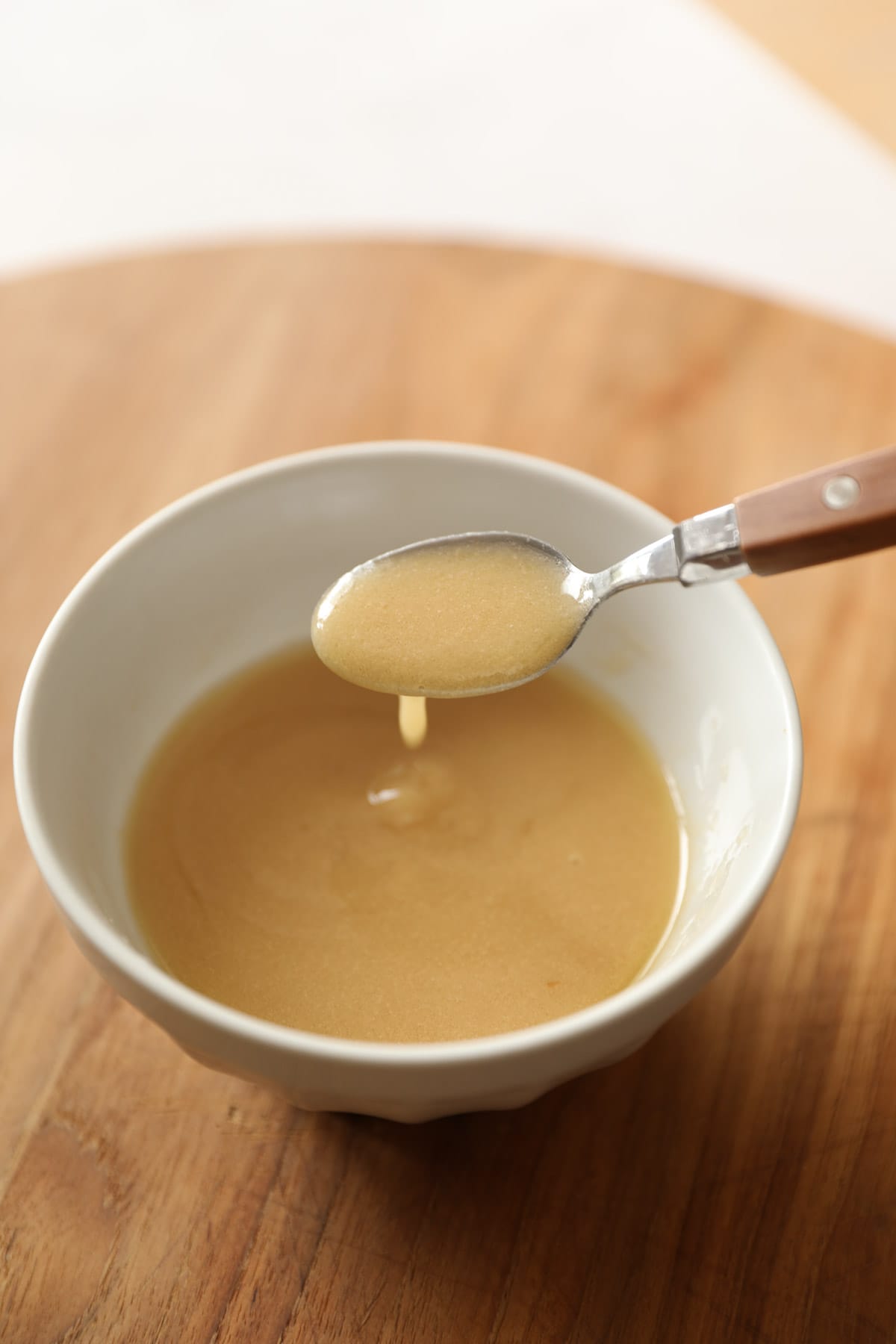 a spoon in a bowl of vinaigrette