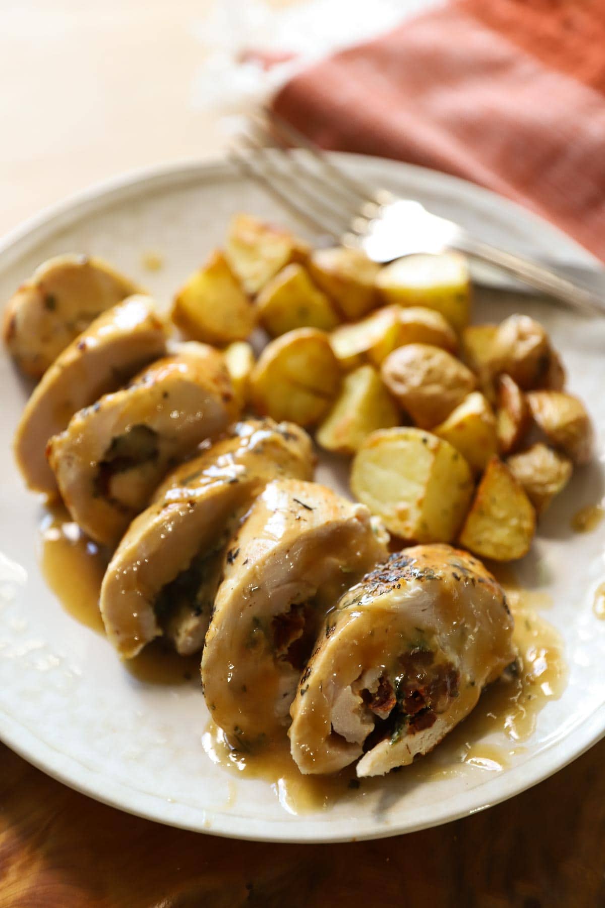 A sliced stuffed chicken breast goes beautifully with my roasted potatoes. 