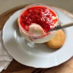 Easy panna cotta recipe topped with rhubarb and berry compote