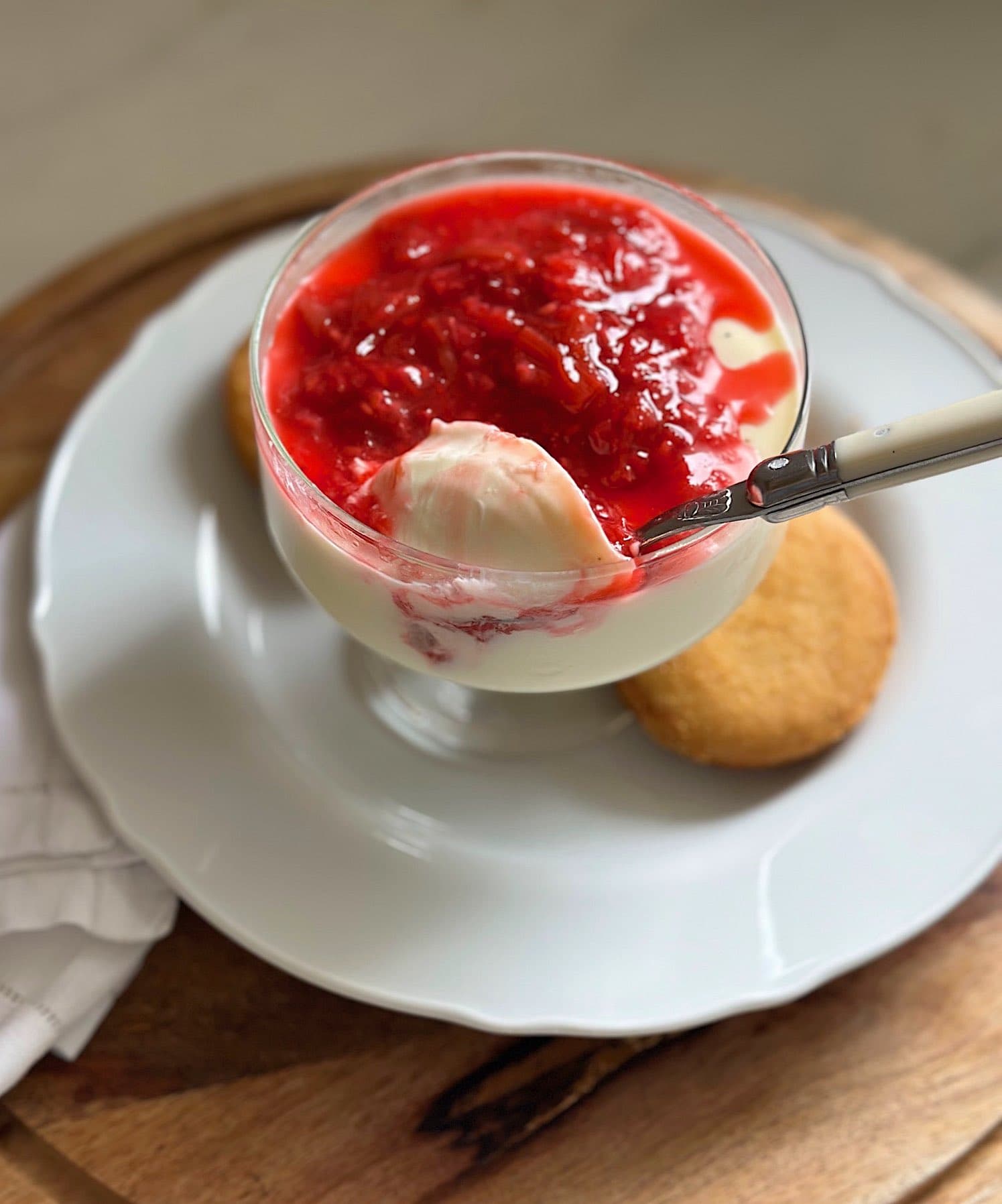 Easy panna cotta recipe topped with rhubarb and berry compote