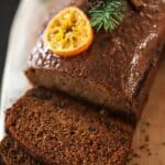 French spiced cake sliced on a cutting board.