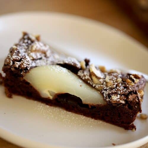 A slice of Chocolate Pear Tart on a Plate