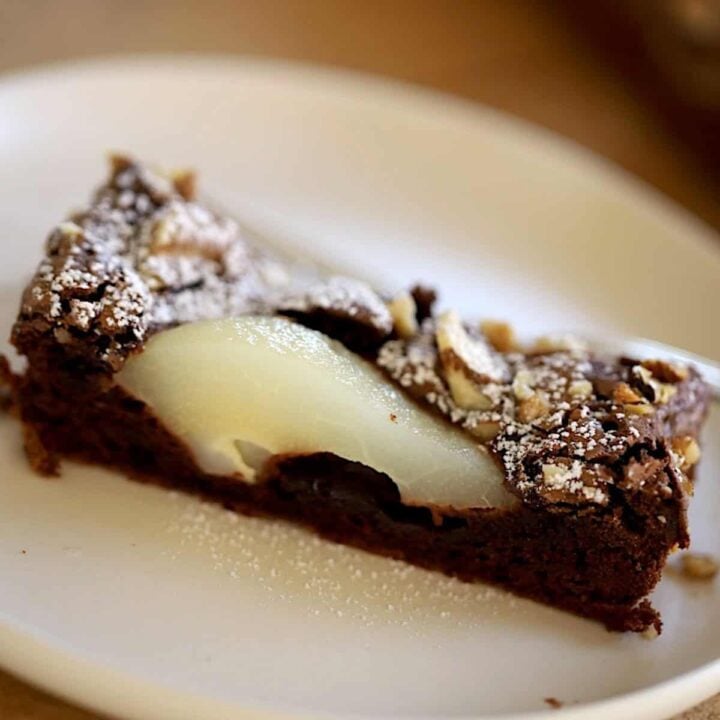 A slice of Chocolate Pear Tart on a Plate