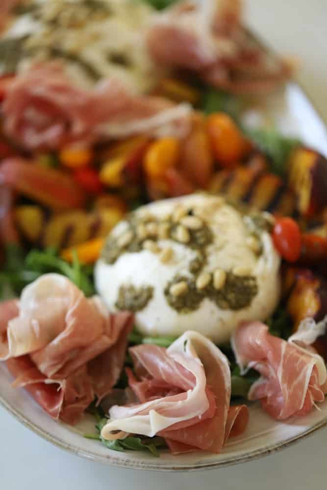 prosciutto added to a grilled peach salad.