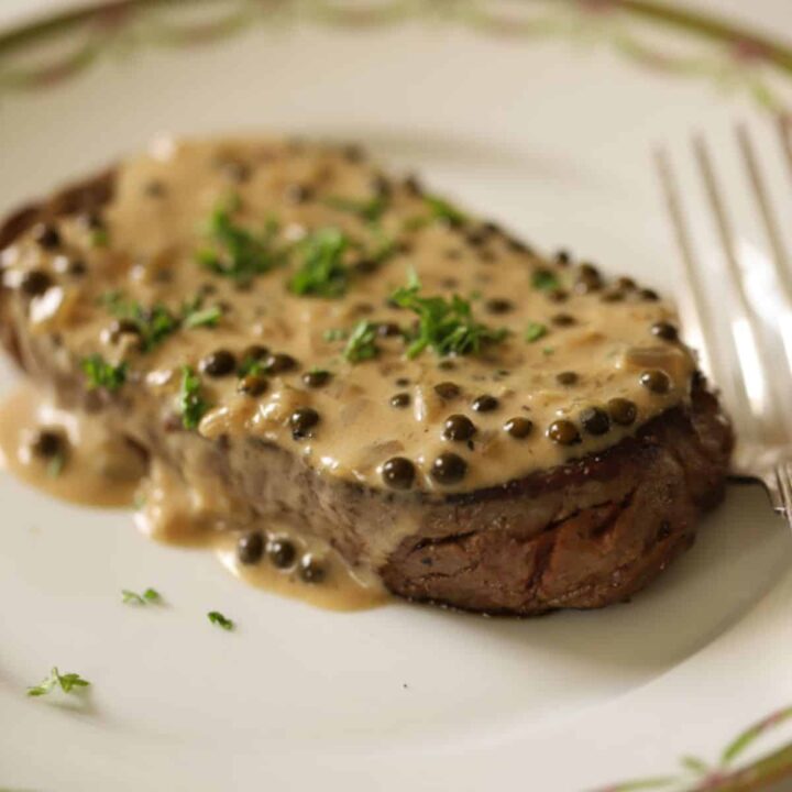 A steak with peppercorn sauce.