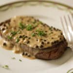Steak with peppercorn sauce