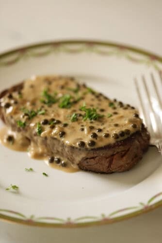 Steak with peppercorn sauce