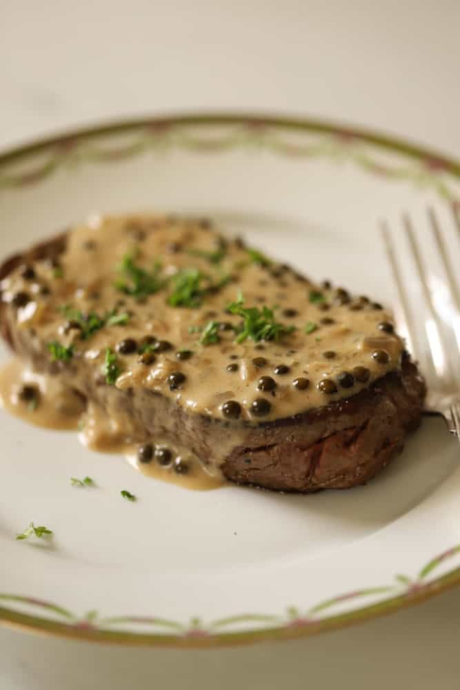 Steak with peppercorn sauce