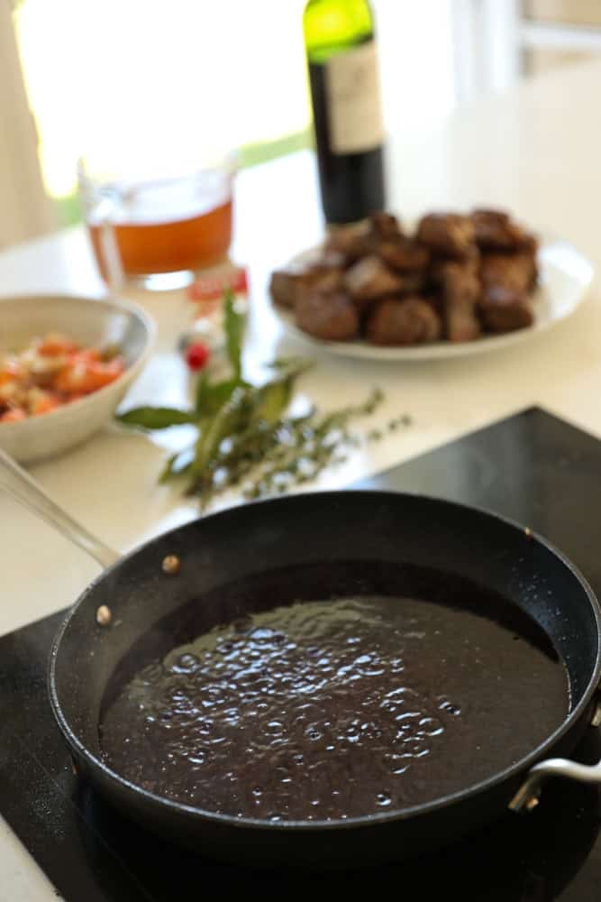 deglazing the skillet with red wine.