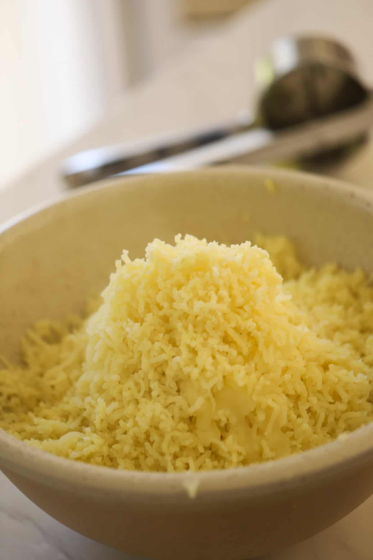 A large bowl of riced potatoes.