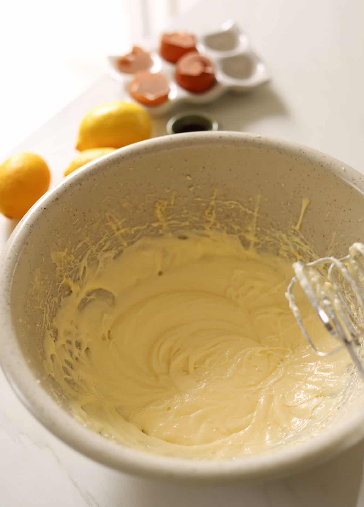 Butter, eggs and sugar beaten in a bowl.