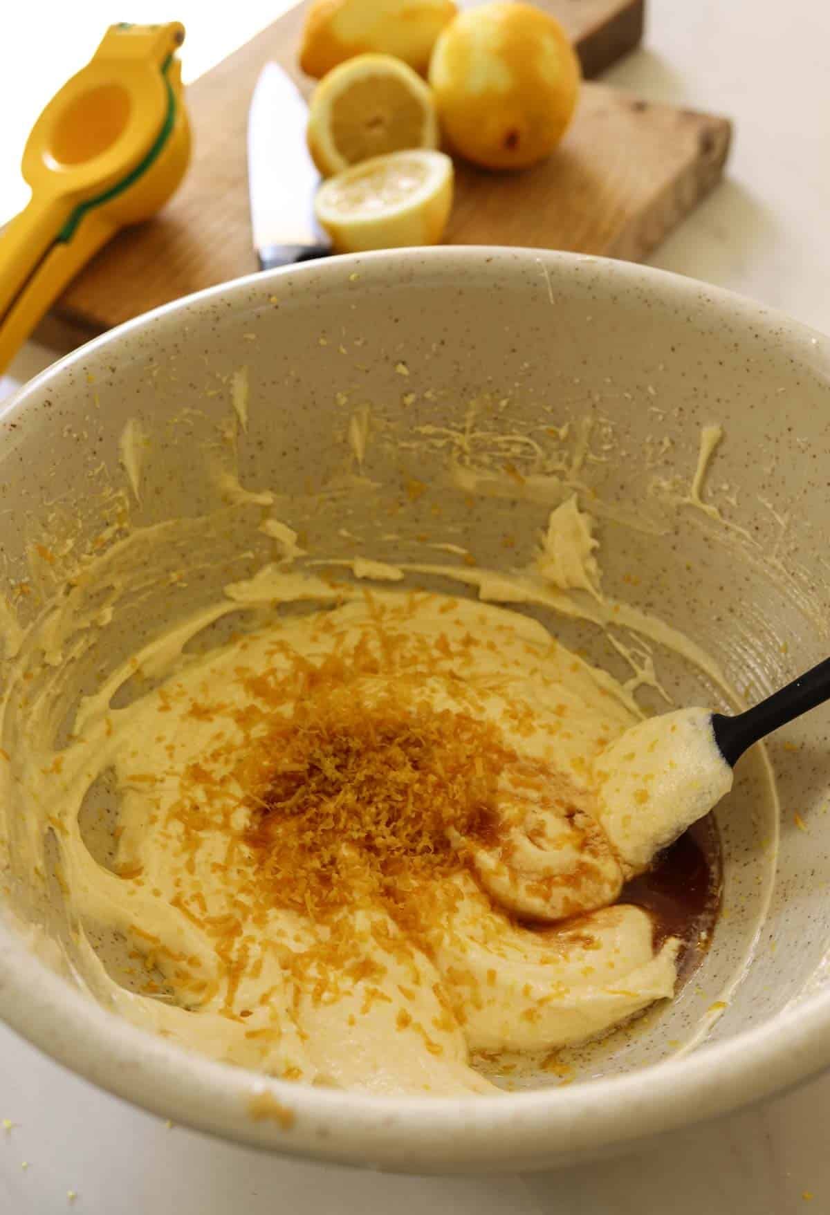 Lemon zest, juice and vanilla adding to a cake batter.