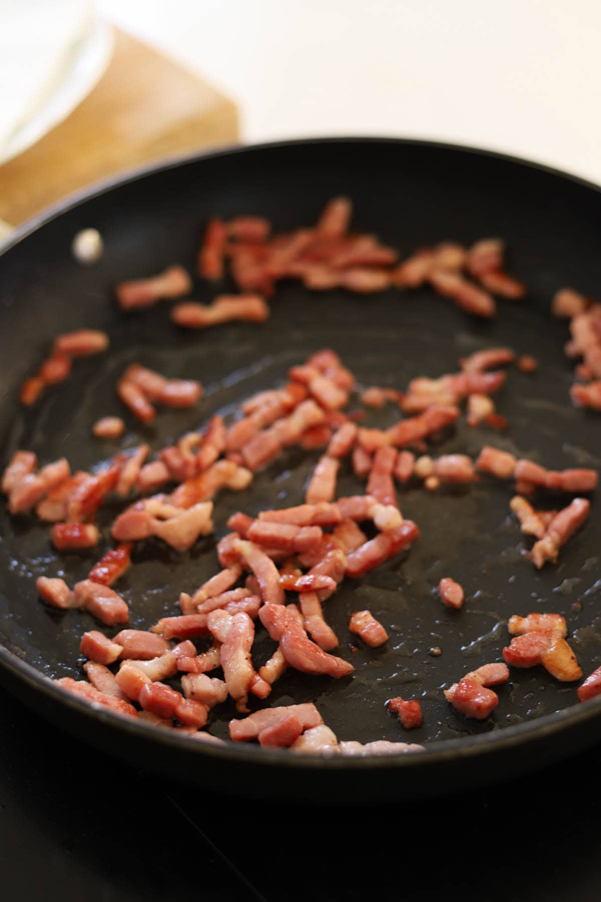 Lardons, French Bacon, cooking up in an non-stick skillet