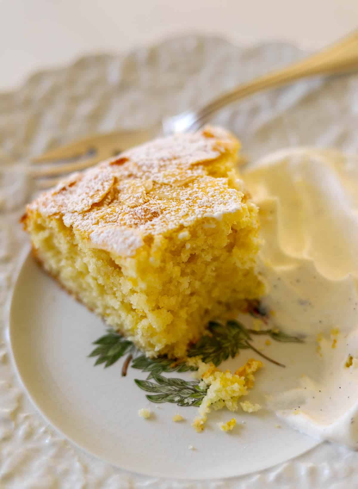 A half-eaten slice of cake showing fluffy texture.