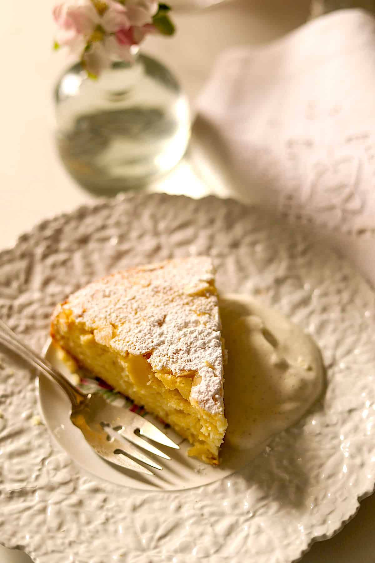 a slice of lemon ricotta cake on a plate.
