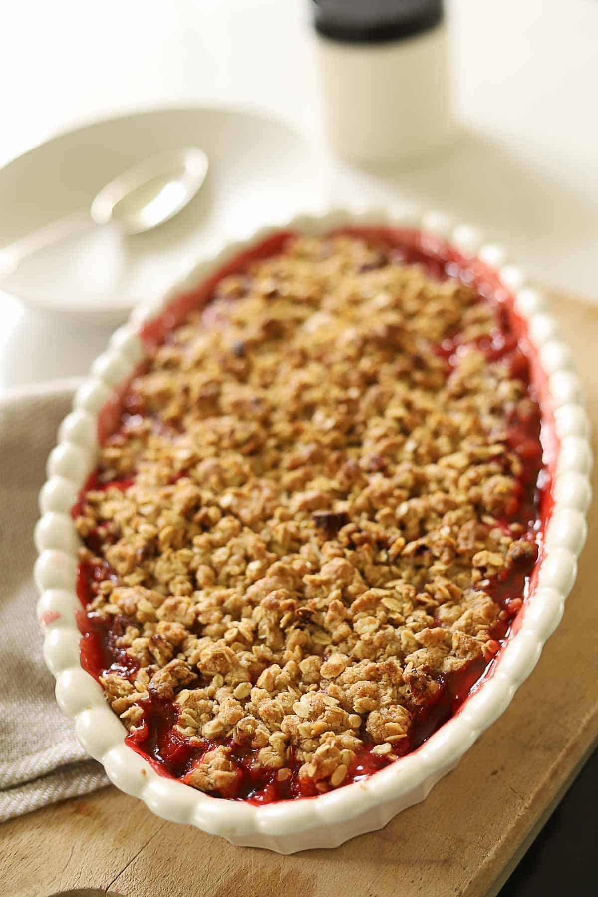a casserole of strawberry and rhubarb crisp with juices bubbling up on the sides.